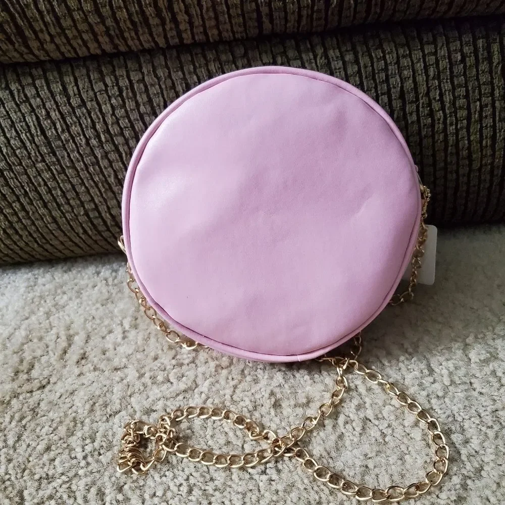 Round pink crossbody with faux pearls